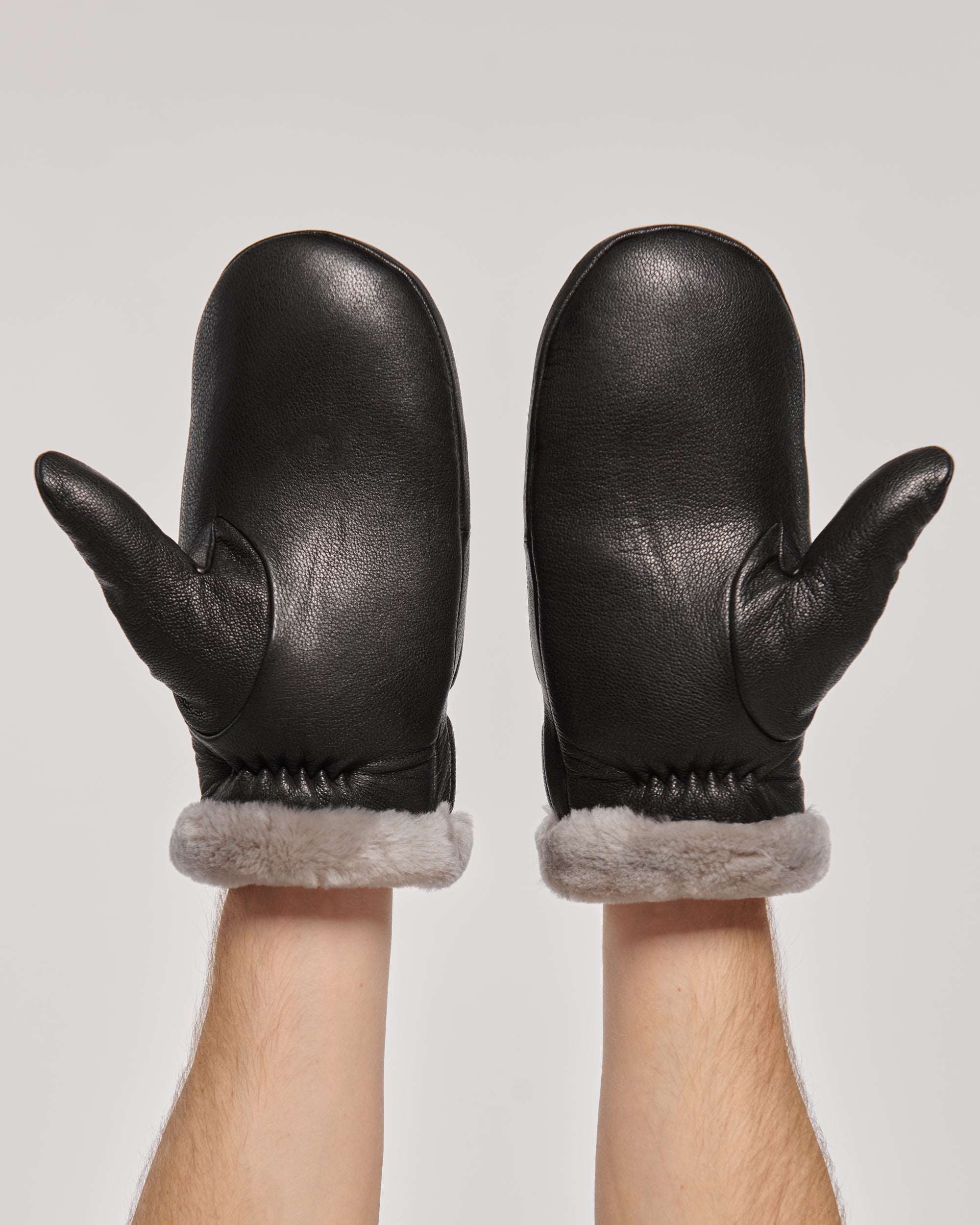 Cozy Men's Leather Mittens with Natural Fur in Black.